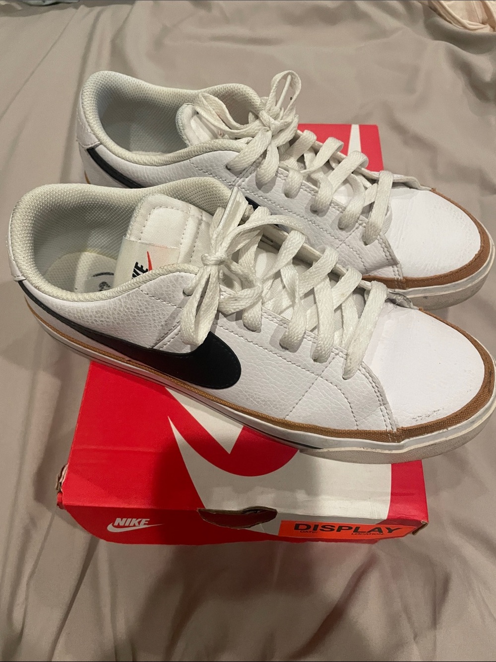 Nike White Sneakers with Black Swoosh and Brown Trim